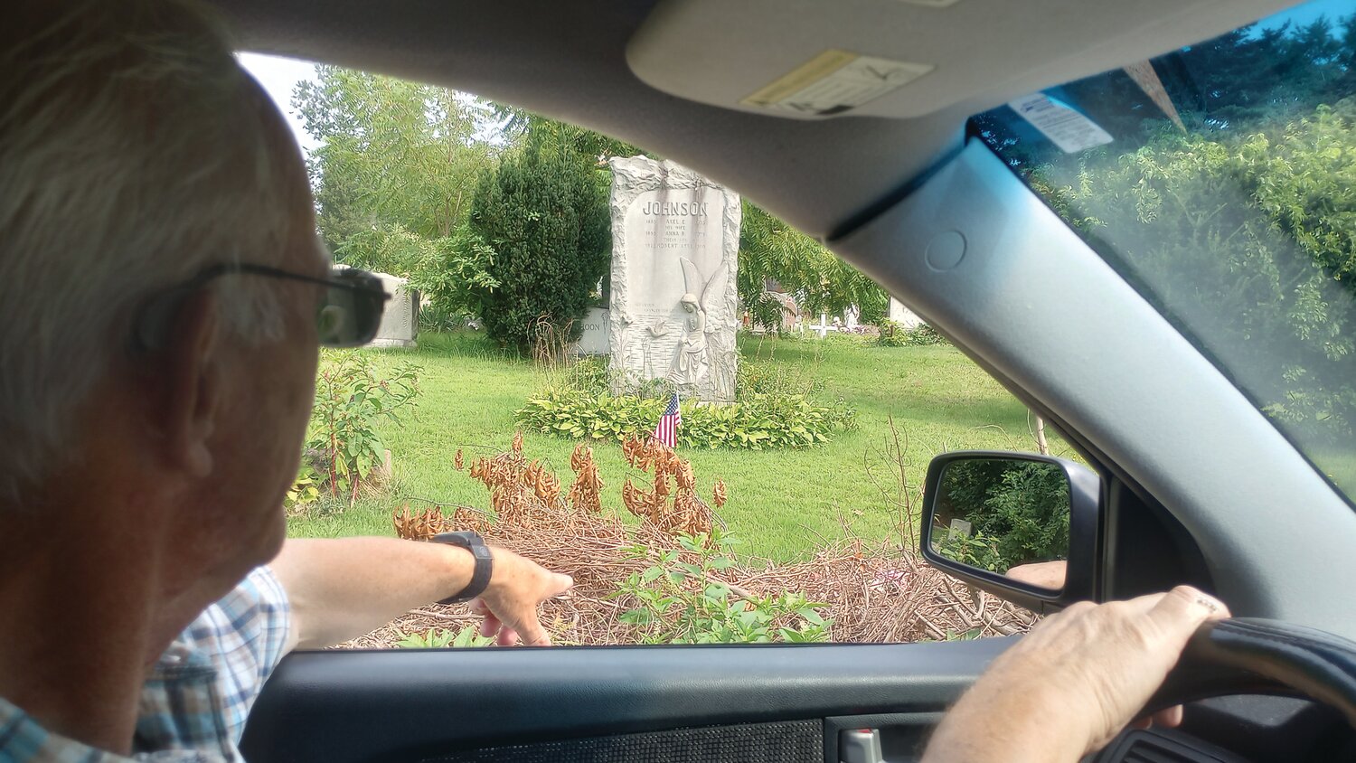 SAD TO SEE: Pastor Russell Farmer of the Gateway Pentecostal Church on Park Avenue drives through Oakland Cemetery while pointing out the never ending trash and brush that litters the area.
